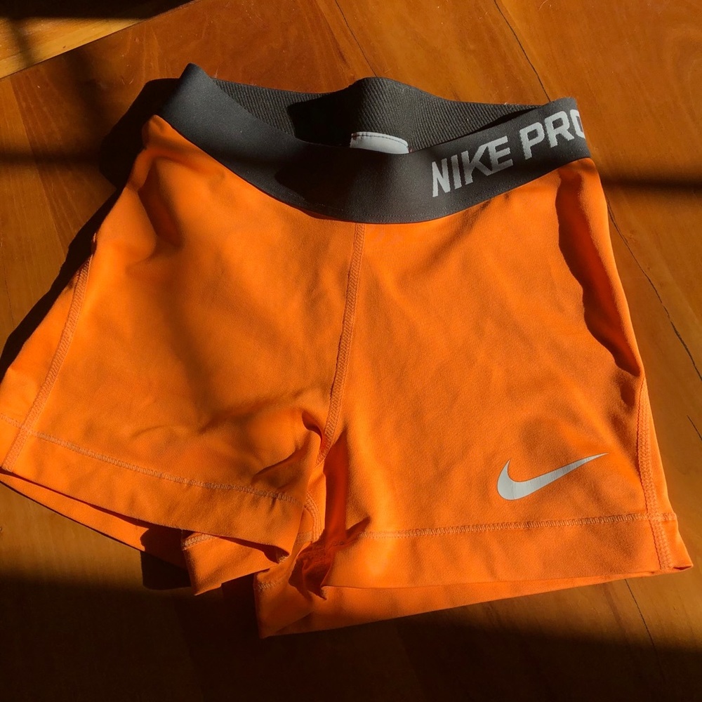 Orange Nike Pro dri-fit shorts